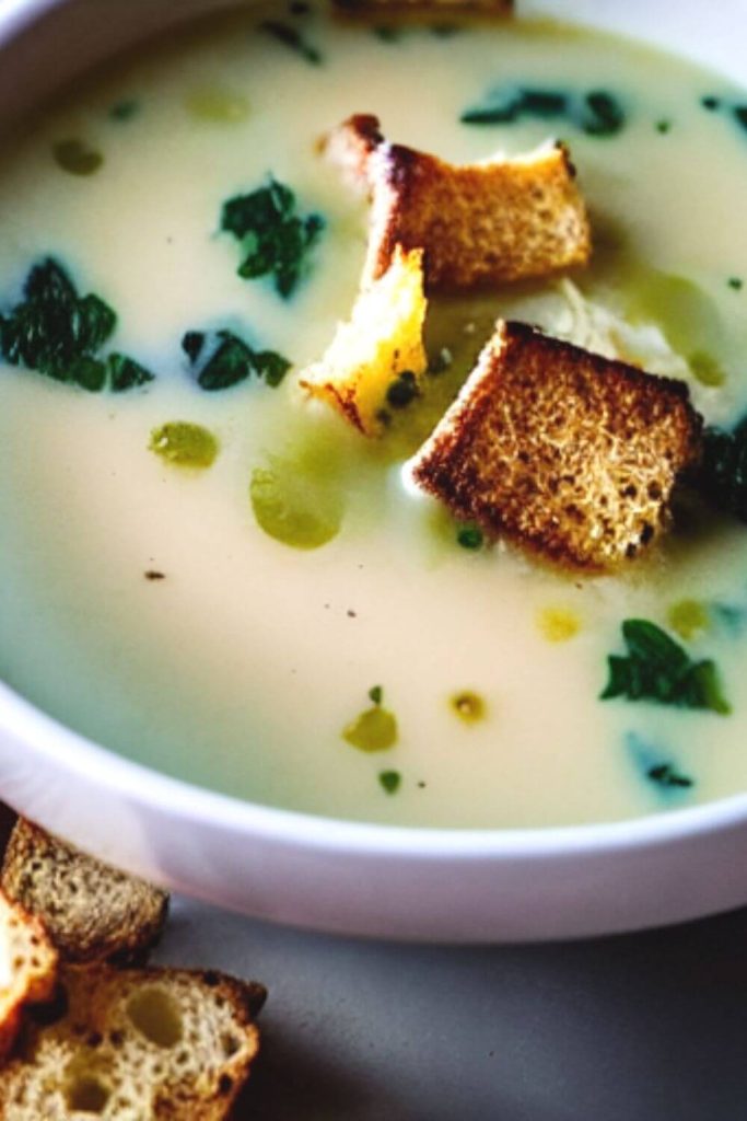 white bowl with Tuscan kale soup and croutons